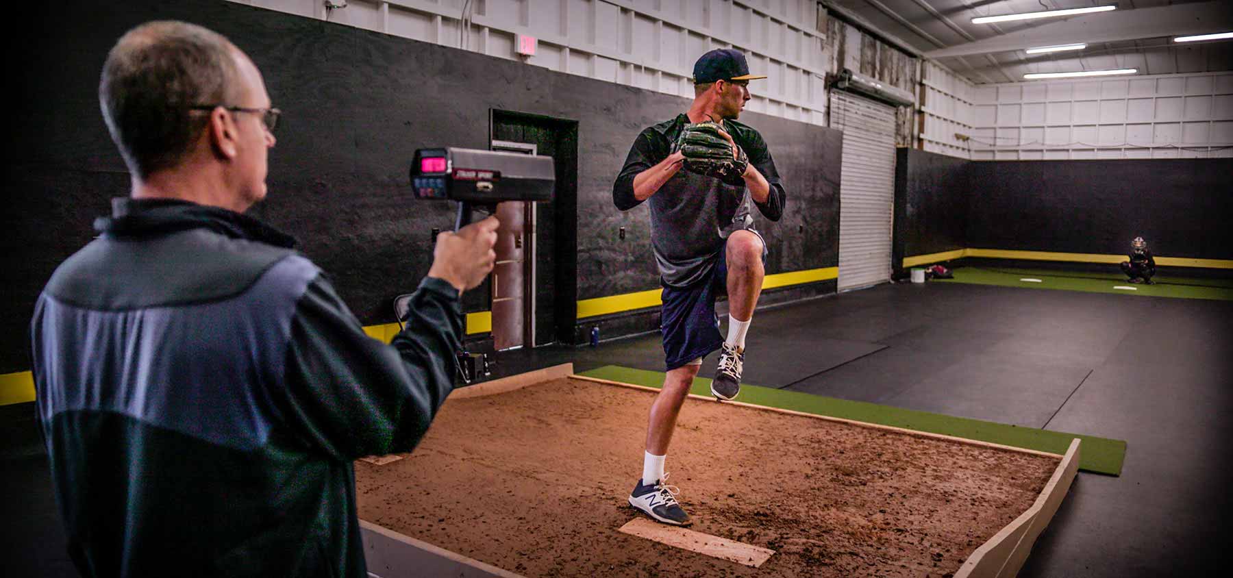 NPA West coach with pitcher on mound speed gun